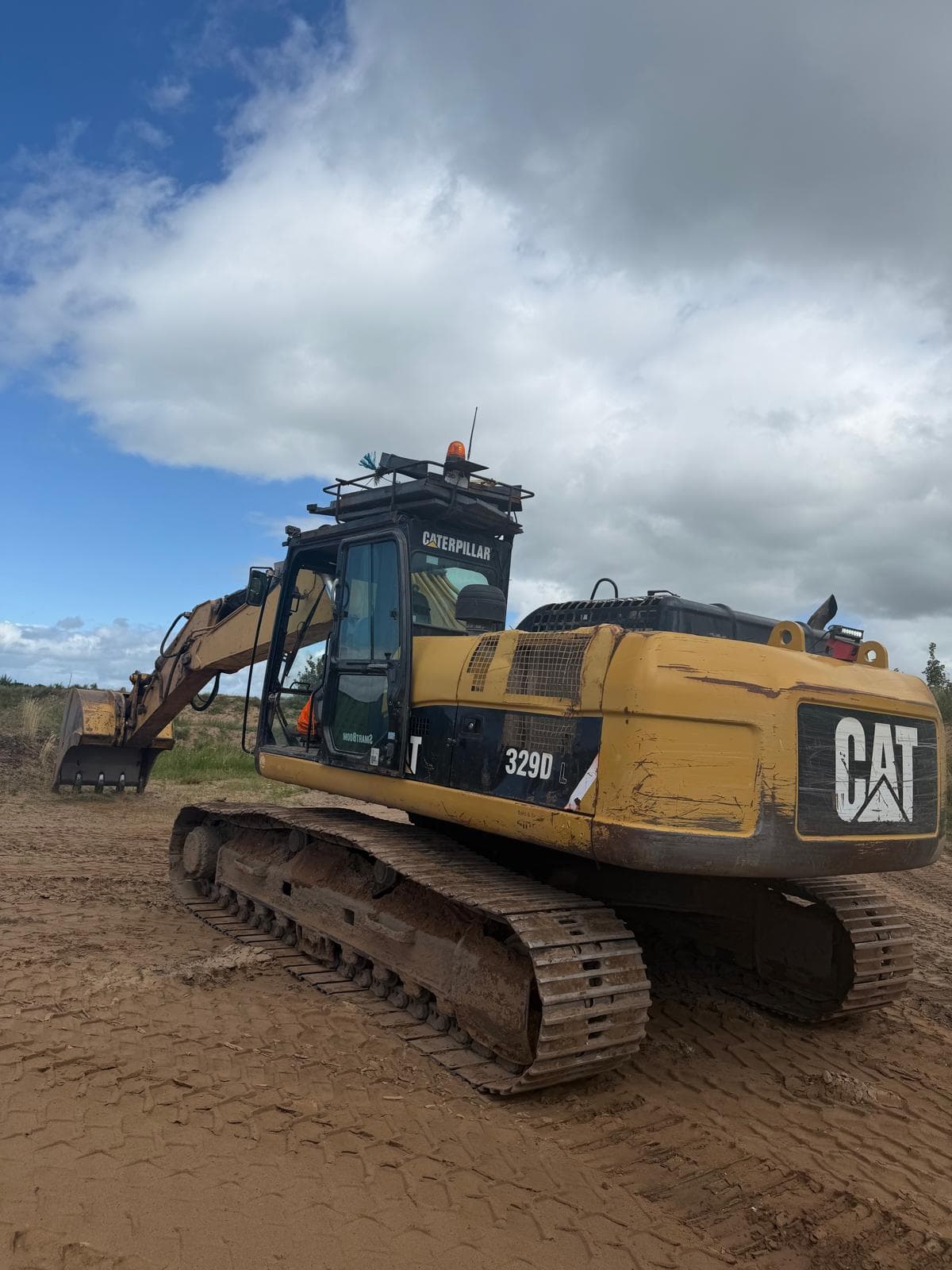 Tracked excavator operating in a quarry